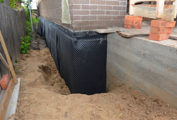 SJ Waterproofing Pros technician performing targeted Interior Drainage System assessment in Erwin, TN
